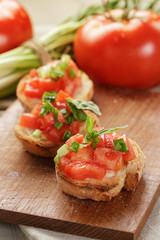 Fototapeta na wymiar Italian bruschetta with tomatoes onion and basil