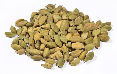 Heap of cardamom seeds on a white