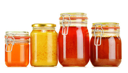 Composition with jar of honey isolated on white