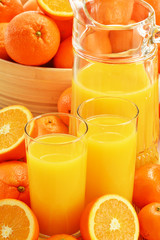 Composition with glasses of orange juice and fruits