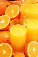 Composition with glasses of orange juice and fruits