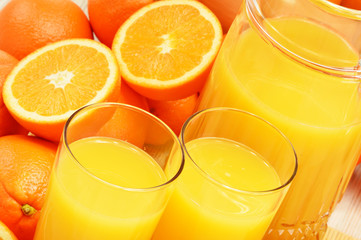 Composition with glasses of orange juice and fruits