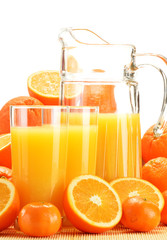 Composition with glasses of orange juice and fruits