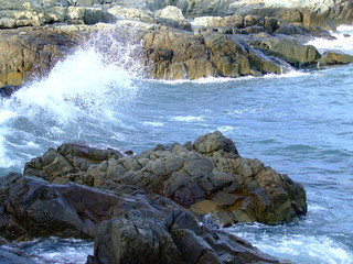. waves breaking on the rocks