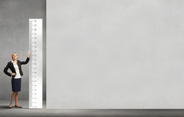 Woman with huge ruler
