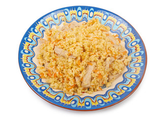 Pilaf dish, bulgur wheat with meat on ceramic plate isolated on