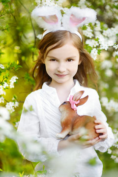 Adorable little girl wearing bunny ears on Easter