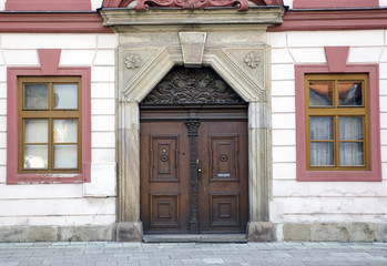 Detail of vintage townhouse in Czech with old door and windows