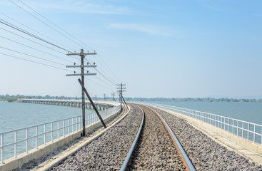 Fototapeta na wymiar Railway track lead across the lake in Thailand