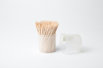 Fototapeta na wymiar toothpicks in a container on a white background