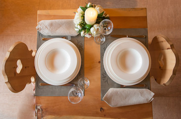 Table set in mountain chalet for two people