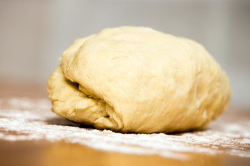 Fototapeta na wymiar Piece of kneaded dough on the table