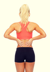Fototapeta premium sporty woman touching her back