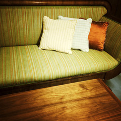 Old retro style sofa with cushions