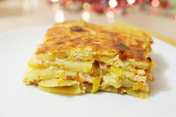 Potato gratin with ham, cream and cheese