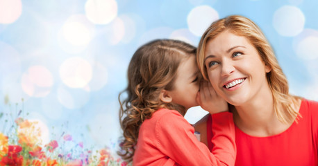 happy daughter whispering gossip to her mother