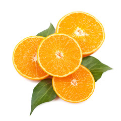 Mandarin orange slices with leaves on a white background