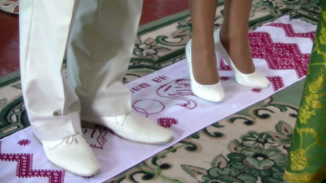 married couple and embroidered towel