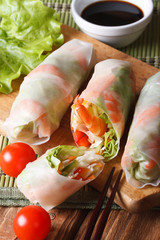 sliced spring rolls with shrimp and vegetables closeup. Vertical