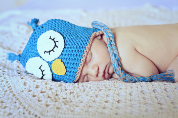newborn in owl hat