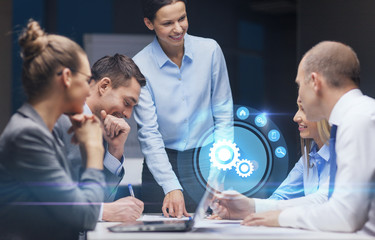 smiling female boss talking to business team