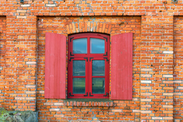 fragment of a brick wall with a window