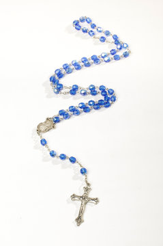 Blue rosary isolated vertical photo