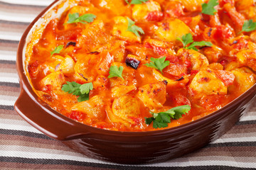Casserole with chicken, potatos and tomatos
