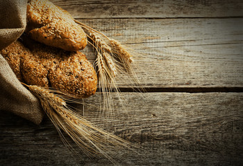 assortment of baked bread on wood table