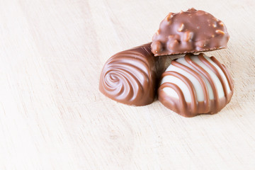 Chocolate pralines on wood