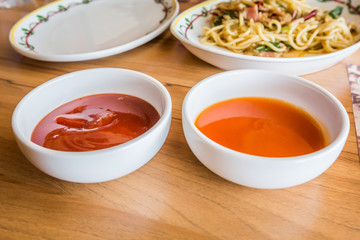 tomato sauce and hot chili sauce.