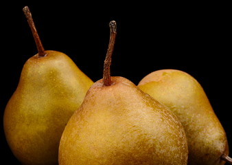 Three pears called manon isolated on black
