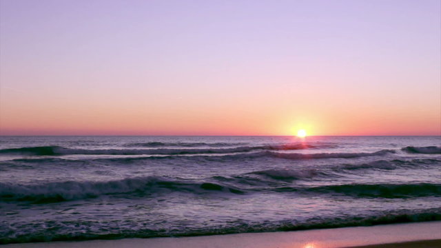 Sunset at Dunas Douradas beach, Algarve.