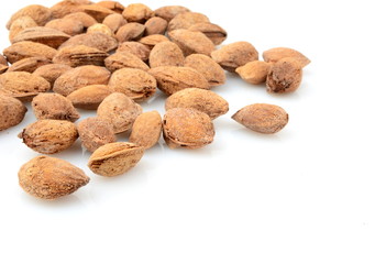 Group of almonds with shell isolated on white