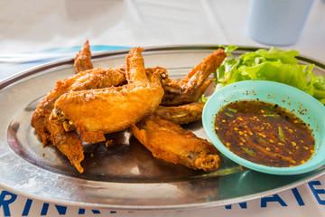 chicken wings with spicy sauce,Thai style.