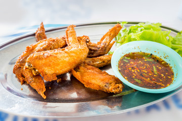 chicken wings with spicy sauce,Thai style.