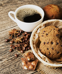 coffee and cookies on wood background