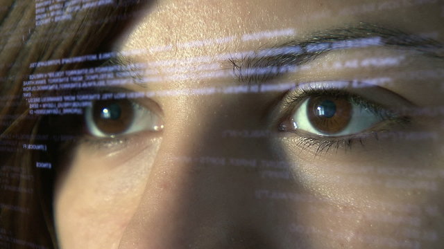 Computer programmer coding on futuristic holographic display