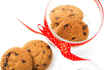 Cookies in a jar decorated with a red ribbon