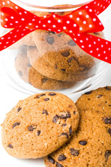 Cookies in a jar decorated with a red ribbon