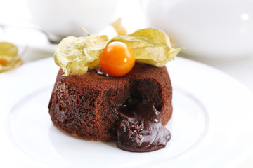 Hot chocolate pudding with fondant centre on plate, close-up