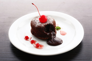 Hot chocolate pudding with fondant centre on plate, close-up