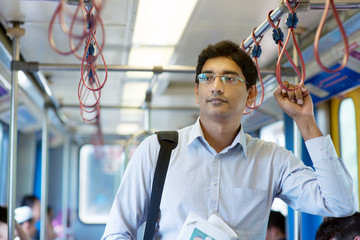 Indian businessman inside train.