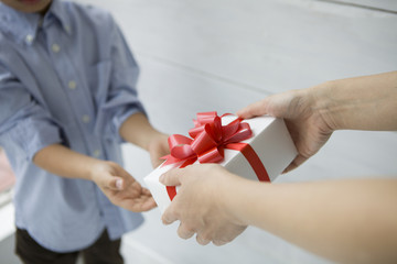 Mother are passing a birthday gift