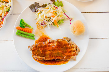 Grilled steaks,bread and vegetable salad