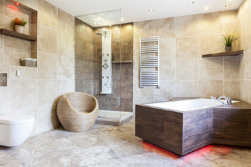 Interior of expensive and brown bathroom