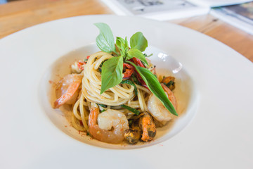 Spicy spaghetti seafood in white dish