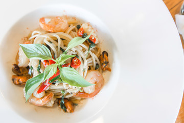 Spicy spaghetti seafood in white dish