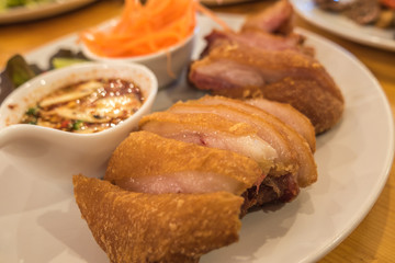 Grilled pork knuckle with spicy sauce