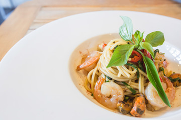Spicy spaghetti seafood in white dish